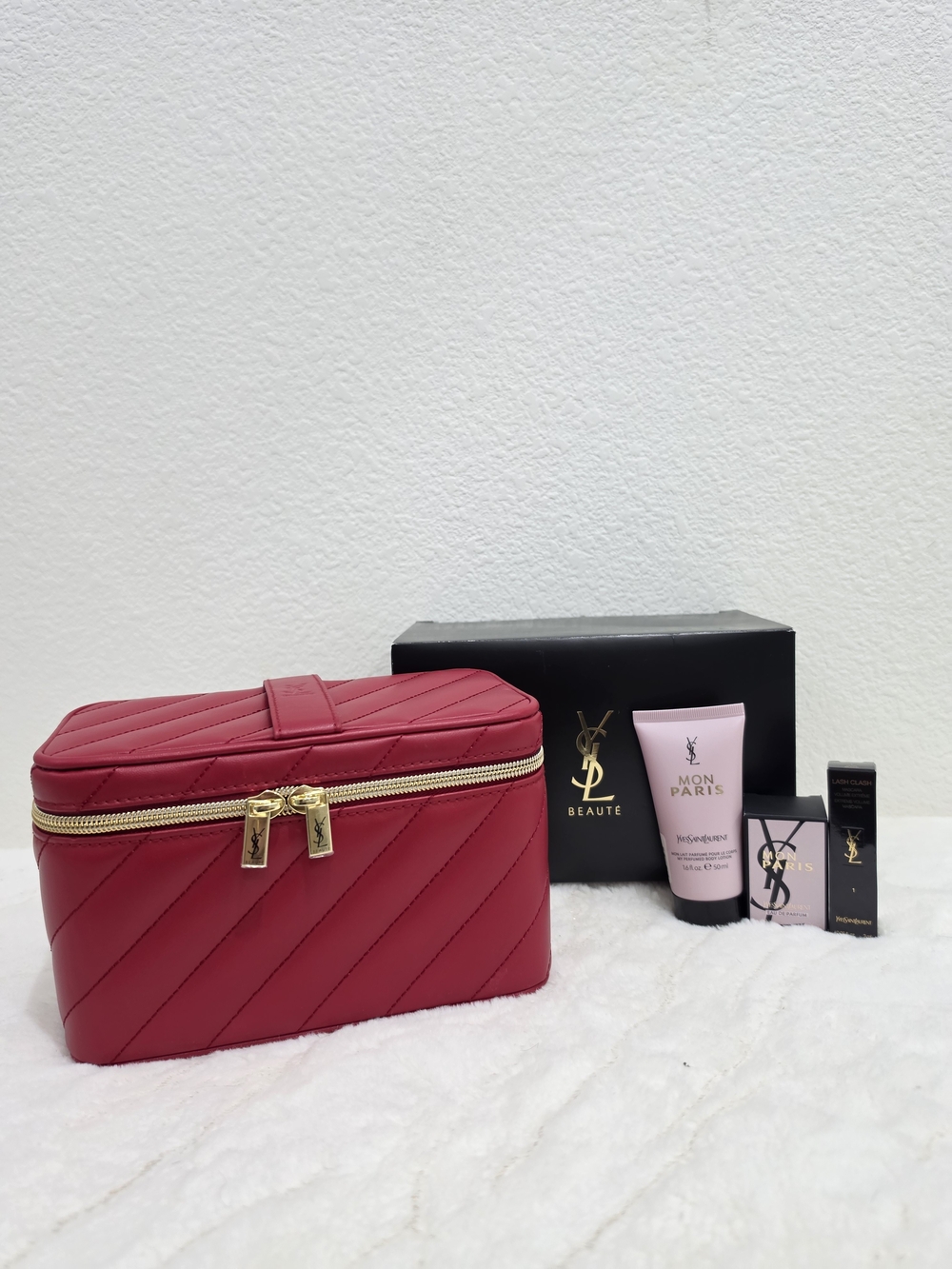 Yves Saint Laurent Red Quilted Cosmetic Case with Gold Zipper.